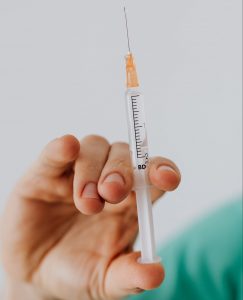 Close up view of person holding a vaccine