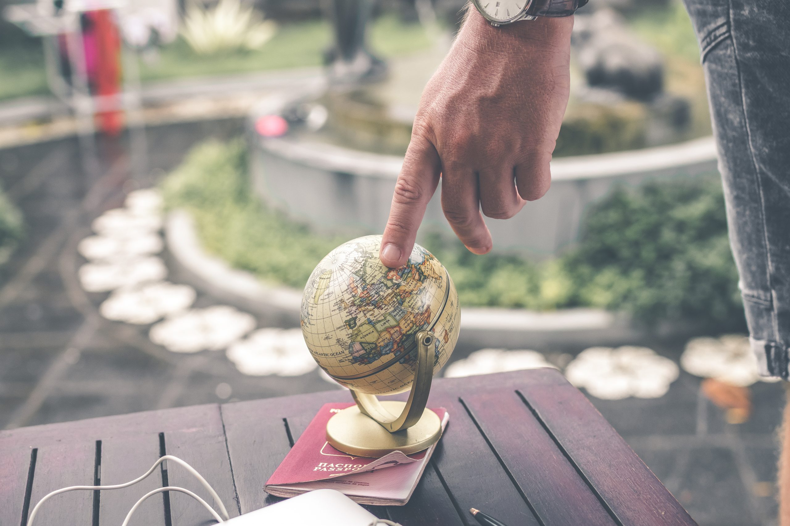 Person holding terrestrial globe scale model taken