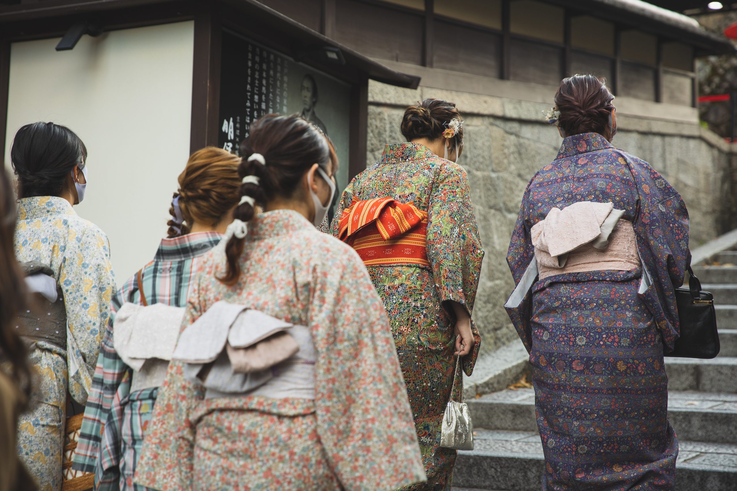 Unrecognizable asian women walking on street